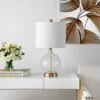 Lovell Table Lamp - 23 Inch Height - TBL4246 - Clear/Gold - Safavieh 1 Lovell Table Lamp - 23 Inch Height - TBL4246 - Clear/Gold - Safavieh -Safavieh Shop GUEST e3f3b6d4 bb37 4d70 8f43 329cbaf04f6e